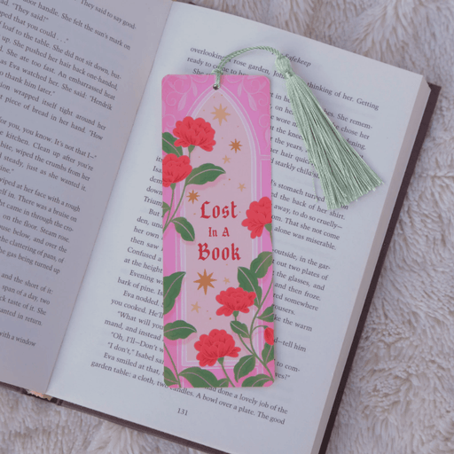 Lost In A Book floral bookmark with green tassel inside an open book