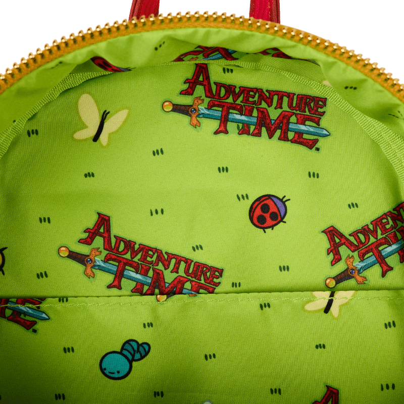 Interior lining of the Adventure Time Loungefly backpack with cartoon icons and logo print on lime green background