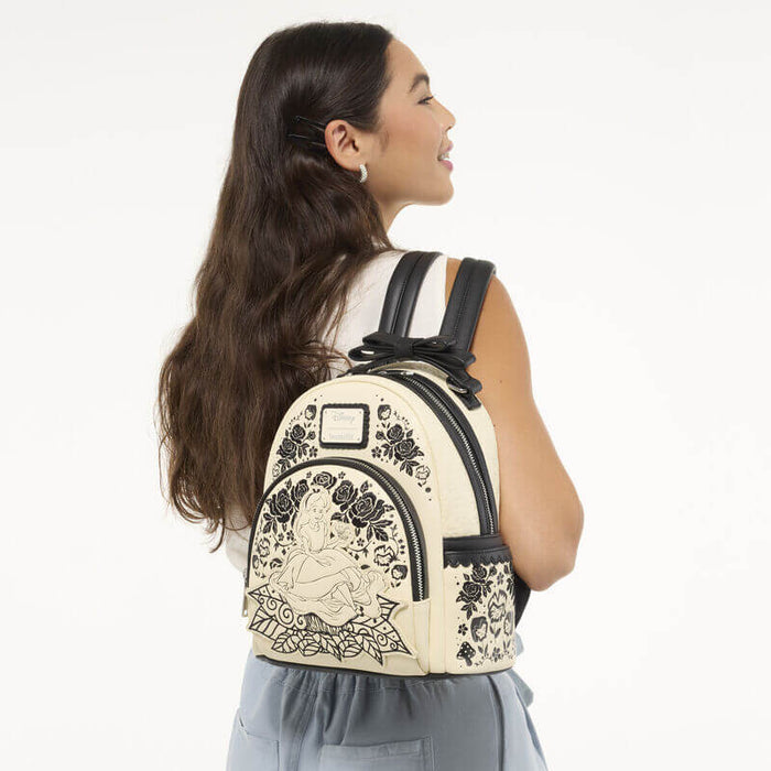 Model wearing Loungefly Disney Alice in Wonderland Floral Mini Backpack