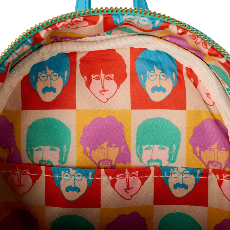 Interior lining of Loungefly Beatles mini backpack featuring bold pop-art portraits of the Fab Four – Loungefly bags detail
