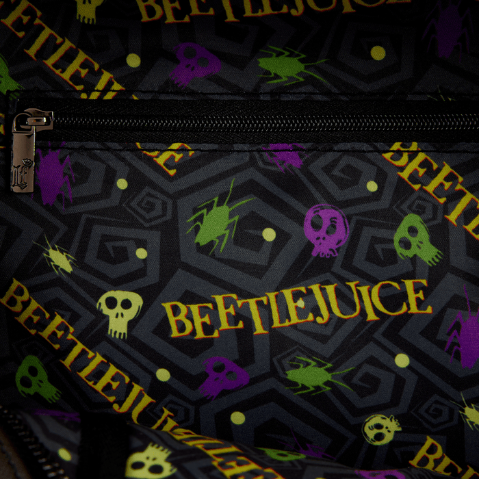Beetlejuice themed interior lining with skulls, spiders and logo, close-up