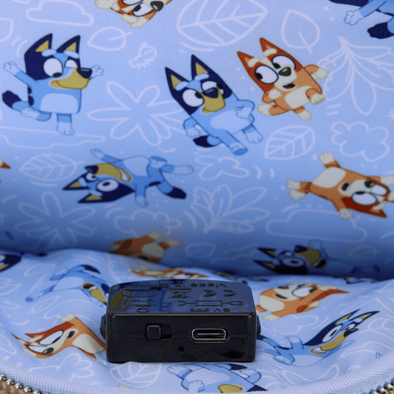 Inside the Loungefly Bluey Light-Up Mini Backpack showing blue character-print lining and integrated light controls