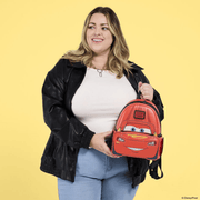 Loungefly Lightning McQueen Cars Mini Backpack held by a model