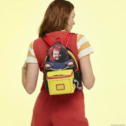 Model wearing Loungefly Chucky pop-up mini backpack on back with red dripping straps visible

