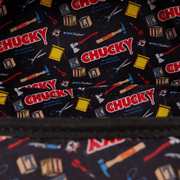 Interior lining of Loungefly Chucky bag featuring repeating Chucky logos, toy blocks and horror tools pattern

