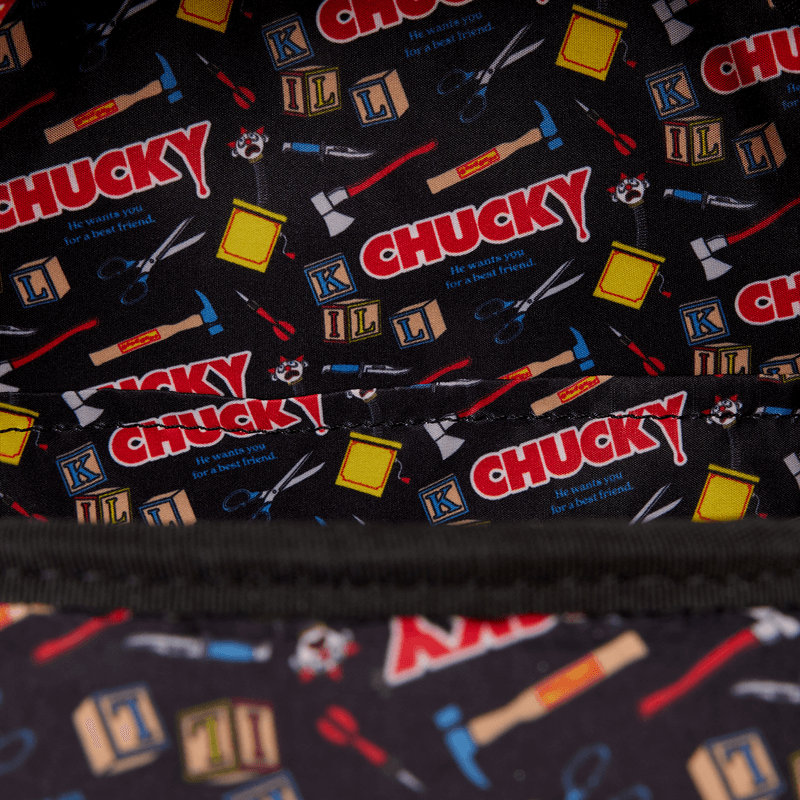 Interior lining of Loungefly Chucky bag featuring repeating Chucky logos, toy blocks and horror tools pattern
