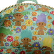 Interior lining of Loungefly Trolls backpack decorated with colourful Trolls and floral pattern
