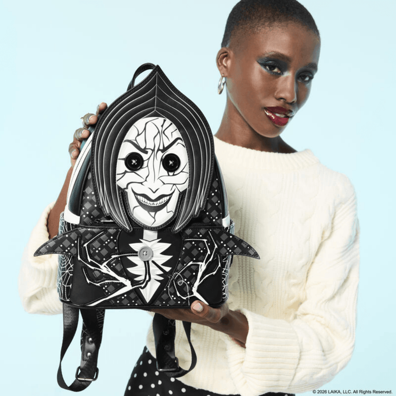 Model holding the Loungefly Coraline Other Mother cosplay mini backpack