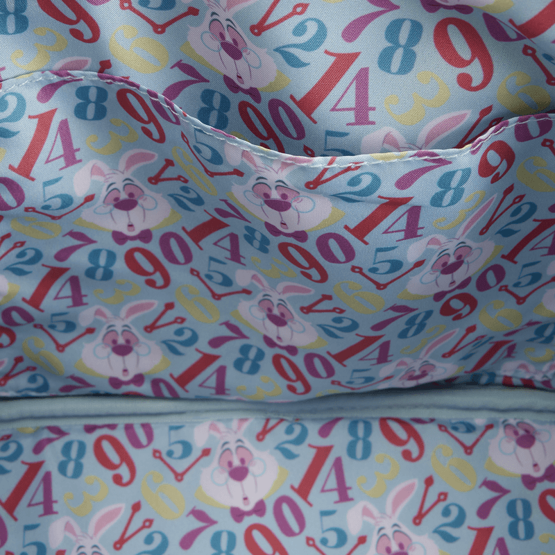 Close-up of the lining inside the Loungefly Disney Alice in Wonderland White Rabbit Handbag with colourful numbers, clock hands and White Rabbit faces