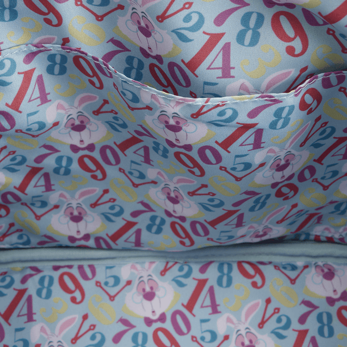 Close-up of the lining inside the Loungefly Disney Alice in Wonderland White Rabbit Handbag with colourful numbers, clock hands and White Rabbit faces