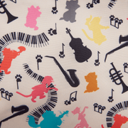 Close-up of the interior lining of the Loungefly Aristocats crossbody bag featuring colourful cat silhouettes, musical notes and instruments.