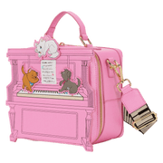 Angled view of the Loungefly Disney The Aristocats figural piano crossbody bag showing the pink piano shape, gold zip and detachable strap.