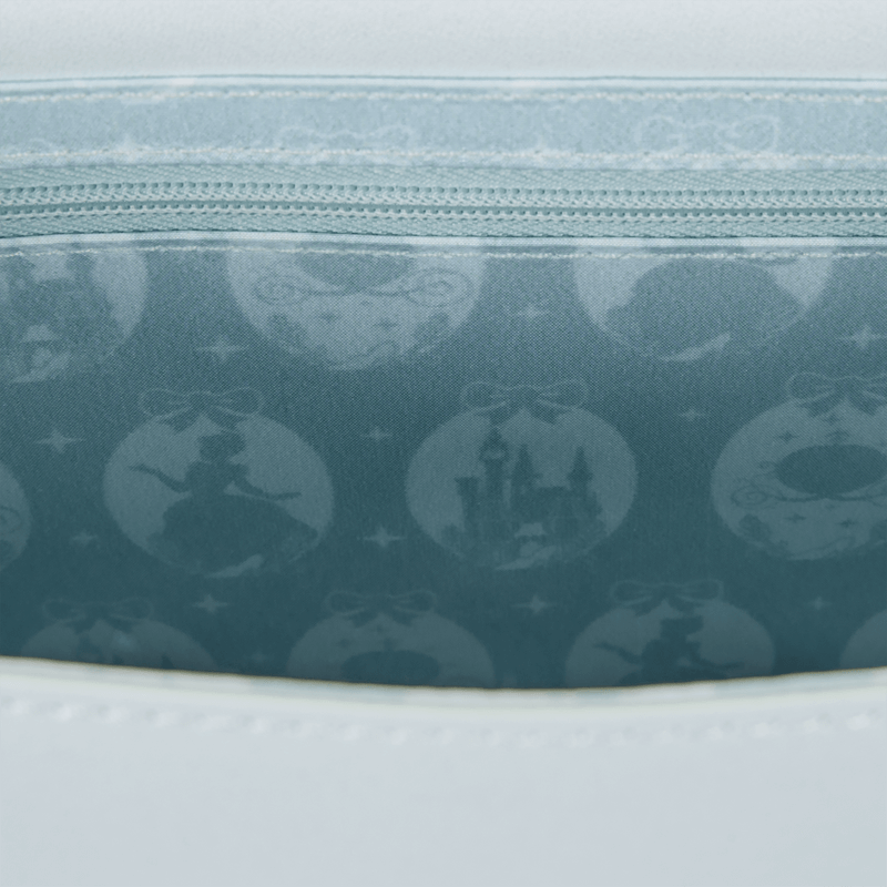 Interior lining of Loungefly Cinderella crossbody bag with character silhouettes and castle
