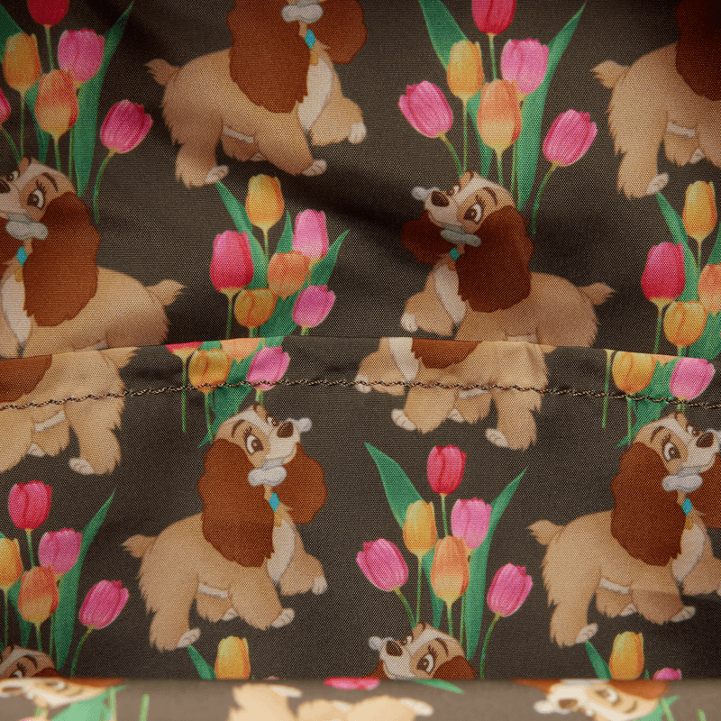 Close-up of the lining inside the Loungefly Disney Lady and the Tramp Pastel Tulip Mini Backpack with an all-over Lady and tulip print