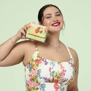 Model holding the Loungefly Disney Lady and the Tramp tulip pastel wallet
