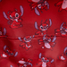 Interior lining of Loungefly Disney Lilo and Stitch Leroy mini backpack with all-over Leroy print