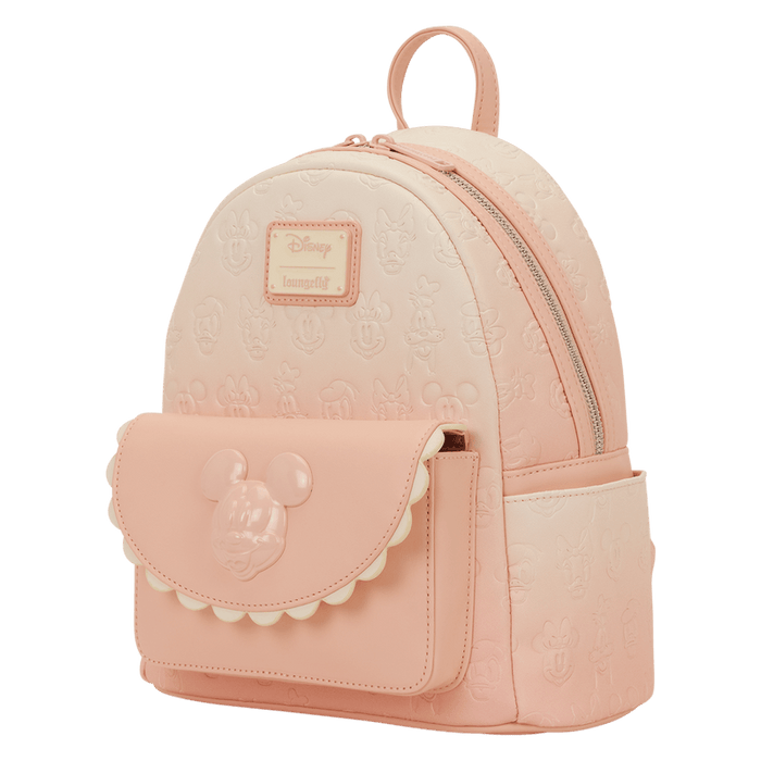 Angled front view of the Loungefly Disney Mickey & Friends All-Over Print Mini Backpack with embossed all-over print and scalloped pocket detail