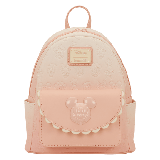 Front view of the Loungefly Disney Mickey & Friends All-Over Print Mini Backpack in pastel pink with embossed character faces and a Mickey front pocket