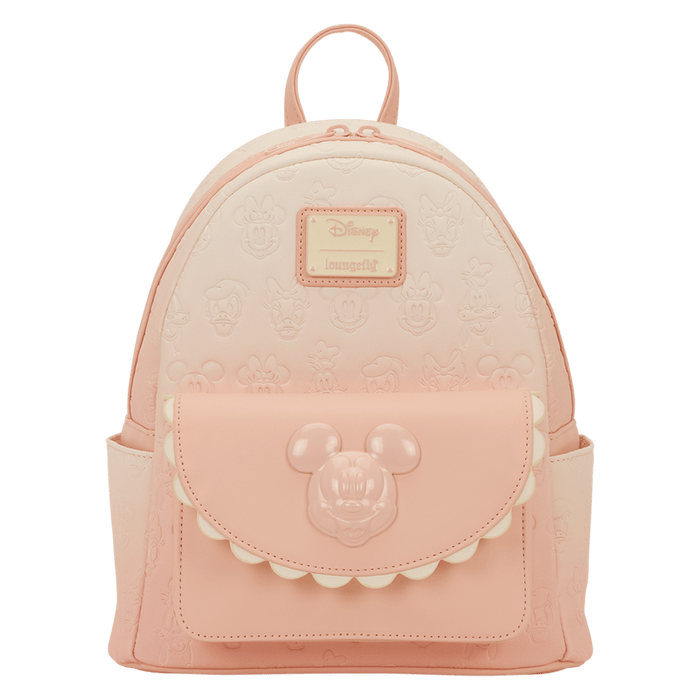 Front view of the Loungefly Disney Mickey & Friends All-Over Print Mini Backpack in pastel pink with embossed character faces and a Mickey front pocket