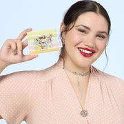Lifestyle image of the Loungefly Disney Mickey & Friends Rainbow Stripes Card Holder held by a model