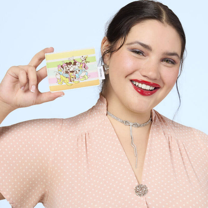 Lifestyle image of the Loungefly Disney Mickey & Friends Rainbow Stripes Card Holder held by a model
