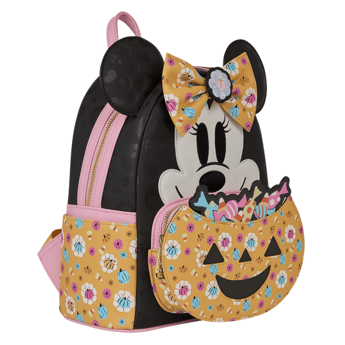 Loungefly Minnie Mouse Halloween mini backpack, angled front view showing bow, ears and pumpkin candy-bucket front pocket