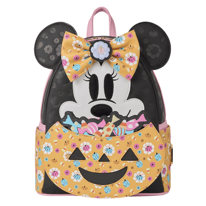 Front view of Loungefly Minnie Mouse Halloween mini backpack with floral bow, ears and smiling jack-o-lantern candy pocket