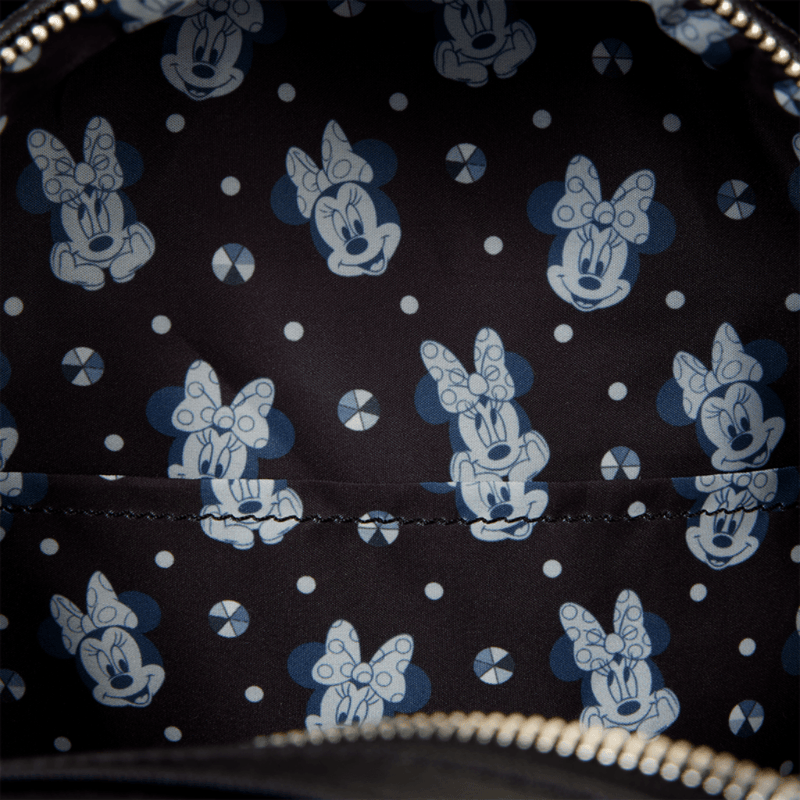 Minnie Mouse patterned interior lining inside the Loungefly Studs & Chains Mini Backpack