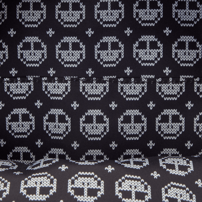 Printed lining with knitted pumpkin icons inside the Loungefly Nightmare Before Christmas backpack.