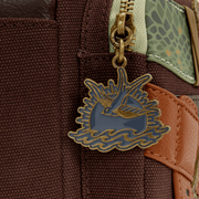 Close up of swallow enamel zipper charm on Loungefly Disney Pirates of the Caribbean Jack Sparrow mini backpack