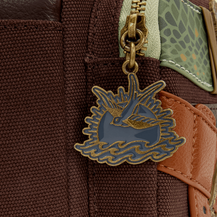 Close up of swallow enamel zipper charm on Loungefly Disney Pirates of the Caribbean Jack Sparrow mini backpack