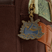 Close up of swallow enamel zipper charm on Loungefly Disney Pirates of the Caribbean Jack Sparrow mini backpack