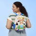 Model wearing Loungefly Disney Pixar Toy Story backpack with blue straps