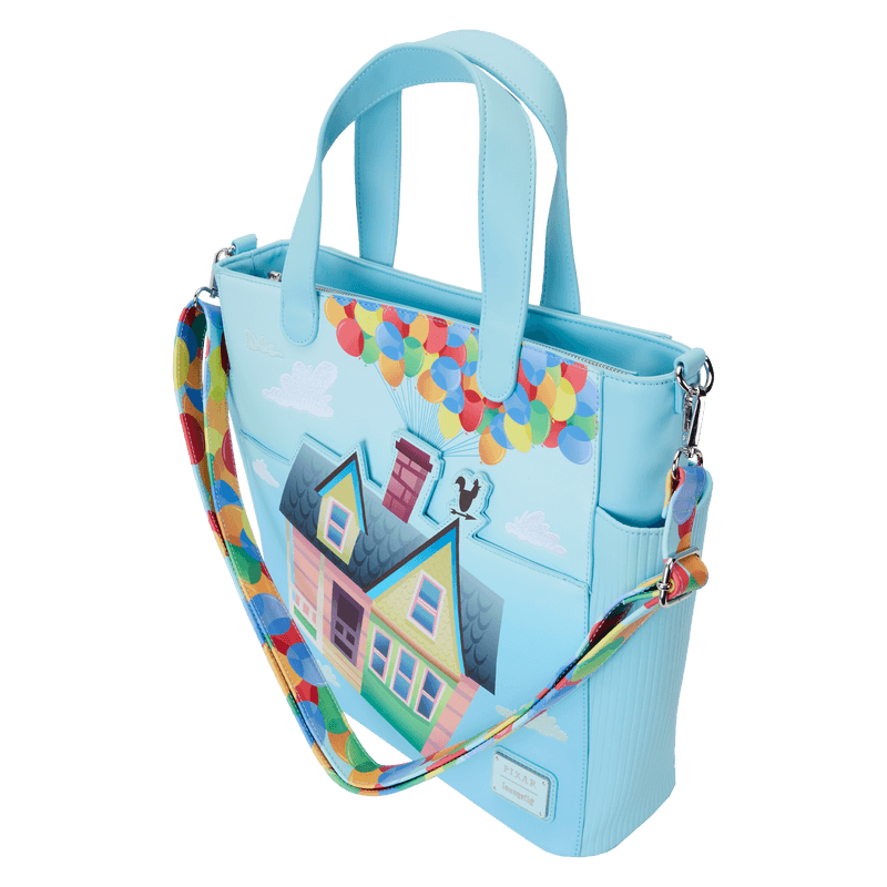 Side view of the Loungefly Disney Pixar Up 15th Anniversary Convertible Tote Bag featuring Carl’s house, colourful balloons and a blue sky background