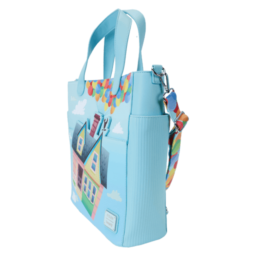Angled front view of the Loungefly Disney Pixar Up 15th Anniversary Convertible Tote Bag with house artwork, balloon-print strap and cloud details