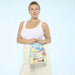 Model holding Loungefly Disney Pixar Up Carl and Russell mini backpack