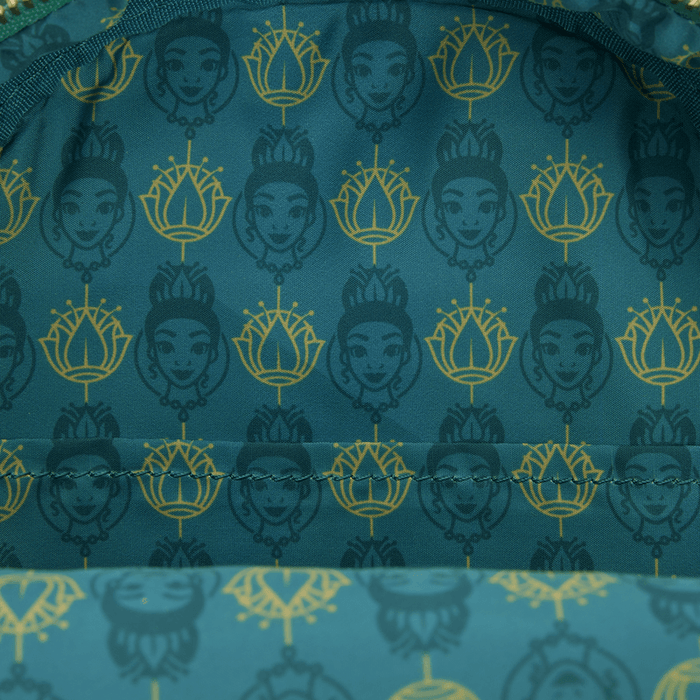 Close-up of the lining inside the Loungefly Disney The Princess and the Frog Tiana Cosplay Mini Backpack with Tiana portrait and lotus print