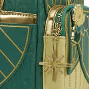 Close-up of the gold star charm and lotus applique on the Loungefly Disney The Princess and the Frog Tiana Cosplay Mini Backpack