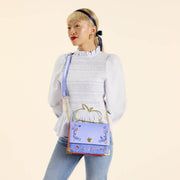 Model wearing Loungefly Snow White crossbody across body, apple handle visible