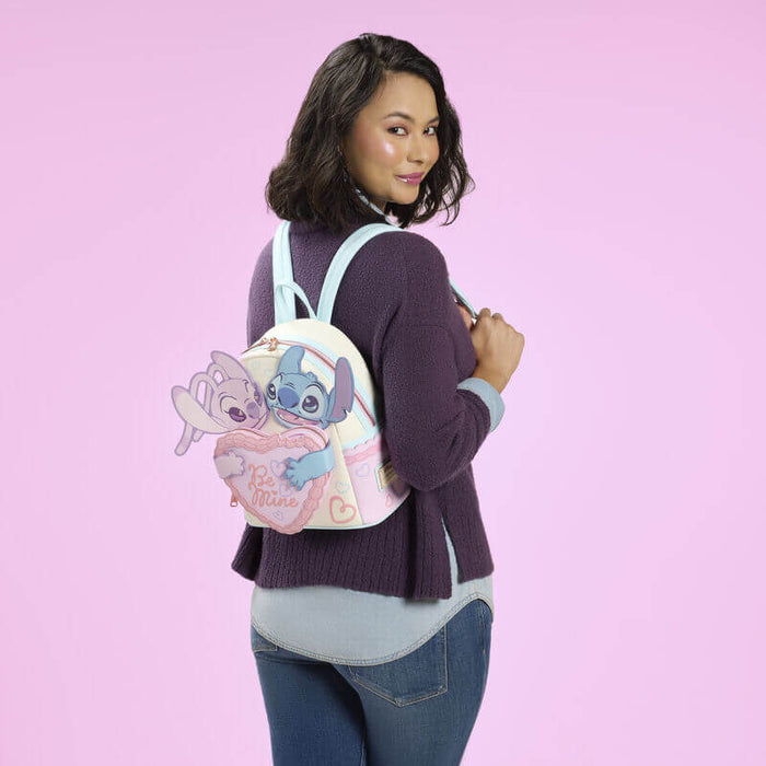 Model wearing Loungefly Stitch and Angel Be Mine mini backpack showing pastel colourway and 3D character details