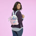 Model wearing Loungefly Stitch and Angel Be Mine mini backpack showing pastel colourway and 3D character details