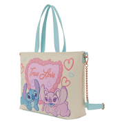 Angled view of the Loungefly Disney Stitch & Angel True Love tote bag showing light blue handles, detachable strap and gold chain detail.