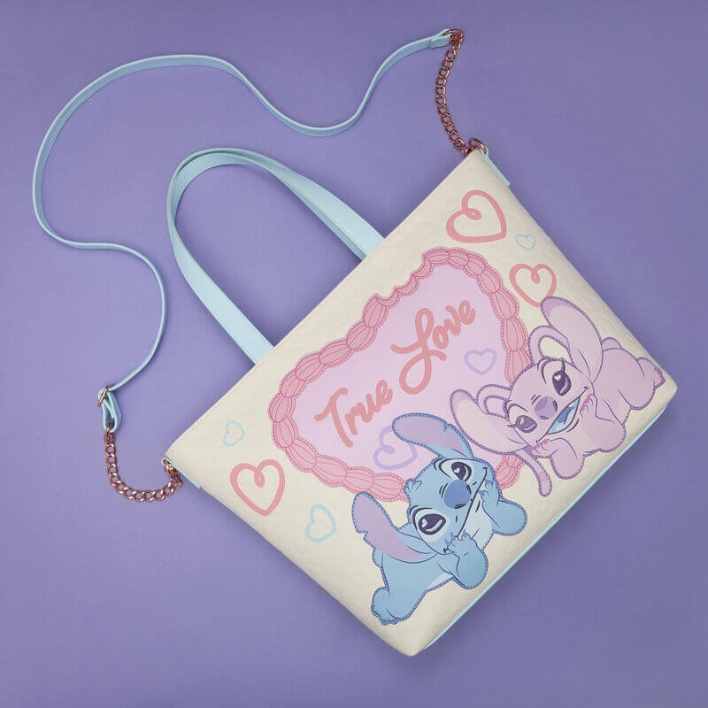 Flat lay of the Loungefly Disney Stitch & Angel True Love tote bag showing the pastel front design, strap and chain attachments.