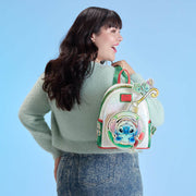 Model wearing Loungefly Stitch ornament mini backpack with pearlescent finish.