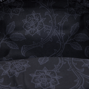 Close-up of tonal black floral lining inside the Loungefly Disney Villains mini backpack