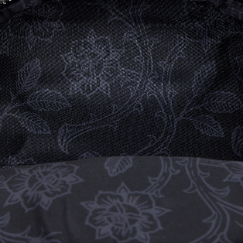 Close-up of tonal black floral lining inside the Loungefly Disney Villains mini backpack