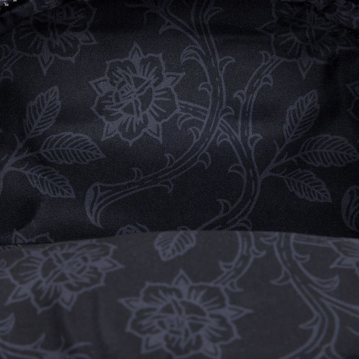 Close-up of tonal black floral lining inside the Loungefly Disney Villains mini backpack