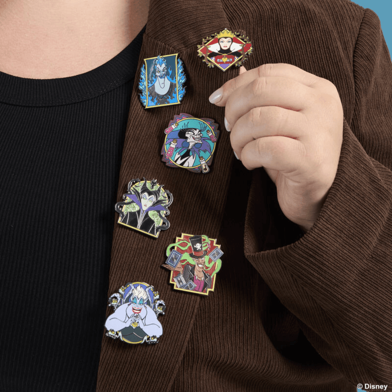 Loungefly Disney Villains mystery enamel pins worn on a jacket
