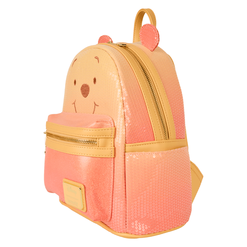Side view of Loungefly Disney Winnie the Pooh glitter mini backpack showing sequin panels and gold zip