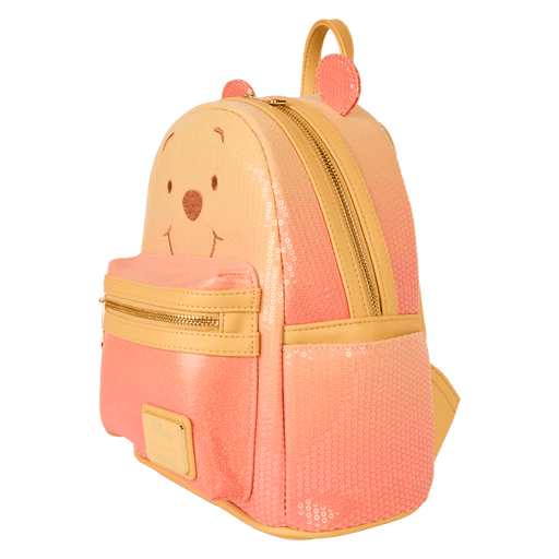 Side view of Loungefly Disney Winnie the Pooh glitter mini backpack showing sequin panels and gold zip